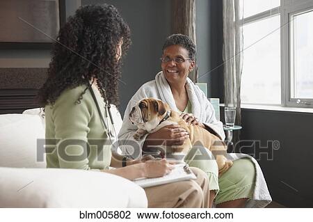 African American nurse checking on patient View Large Photo Image Stock Image - African American nurse checking on patient. Fotosearch