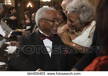 Stock Image - African American people drinking in bar. Fotosearch