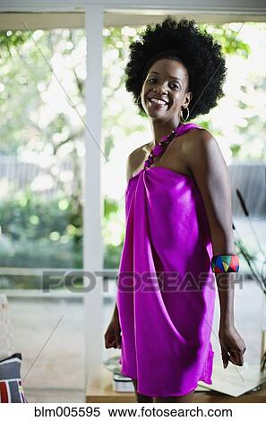 Stock Photography - African American woman in glamorous dress. Fotosearch