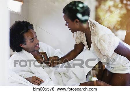 African American woman kneeling on bed with husband View Large Photo Image Stock Photo - African American woman kneeling on bed with husband. Fotosearch