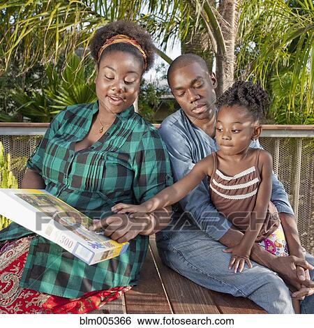 African American woman on patio with family View Large Photo Image Stock Photograph - African American woman on patio with family. Fotosearch