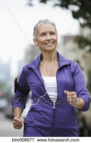 African American woman running in city View Large Photo Image Stock Photo - African American woman running in city. Fotosearch