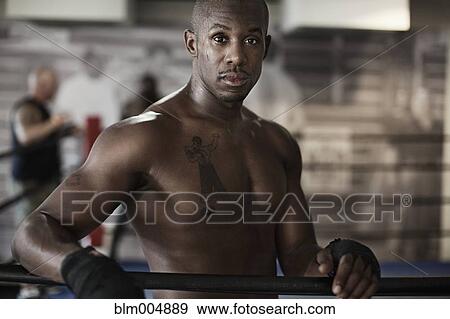 African boxer standing at side of boxing ring View Large Photo Image Stock Photo - African boxer standing at side of boxing ring. Fotosearch