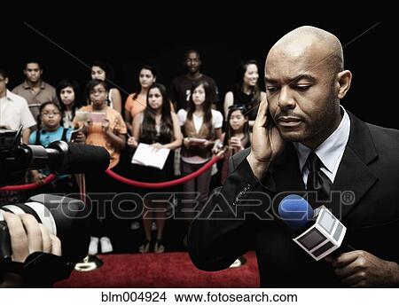 Picture - African broadcaster at red carpet event. Fotosearch