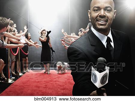 Stock Image - African broadcaster at red carpet event. Fotosearch