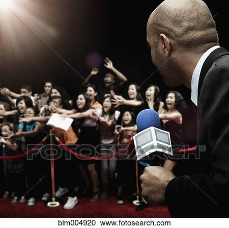 Stock Image - African broadcaster at red carpet event. Fotosearch