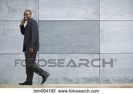 African businessman talking on telephone View Large Photo Image Stock Image - African businessman talking on telephone. Fotosearch
