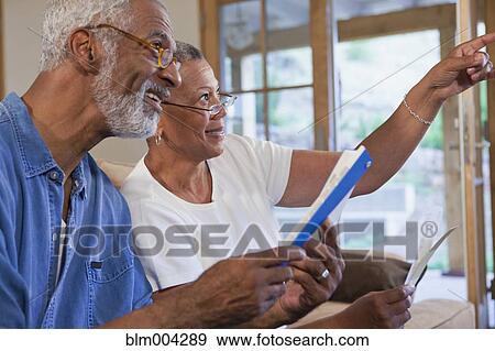 African couple looking at paint swatches View Large Photo Image Stock Photo - African couple looking at paint swatches. Fotosearch