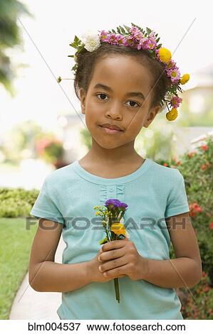 African girl with flowers in hair holding bouquet View Large Photo Image Stock Photo - African girl with flowers in hair holding bouquet. Fotosearch