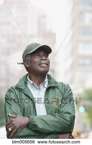 Stock Photograph - African man on urban street. Fotosearch