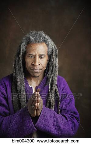 African man with dreadlocks praying View Large Photo Image Stock Image - African man with dreadlocks praying. Fotosearch