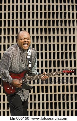 African musician playing electric guitar View Large Photo Image Stock Image - African musician playing electric guitar. Fotosearch