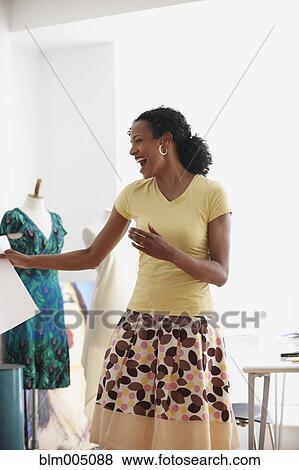 African woman laughing in design studio View Large Photo Image Stock Photo - African woman laughing in design studio. Fotosearch