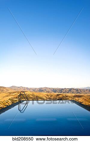 Stock Image - An infinity water pool with steps. Fotosearch
