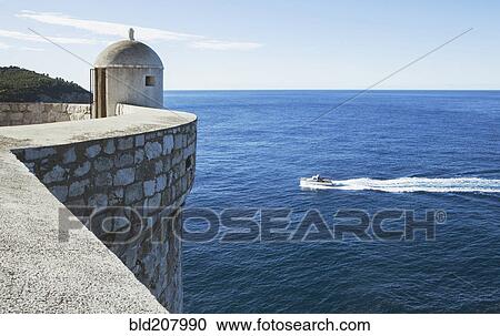 An outpost overlooking the Adriatic Sea on the old city wall in Dubrovnik View Large Photo Image Stock Image - An outpost overlooking the Adriatic Sea on the old city wall in Dubrovnik. Fotosearch