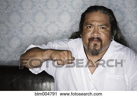 Stock Image - Angry man raising fist. Fotosearch