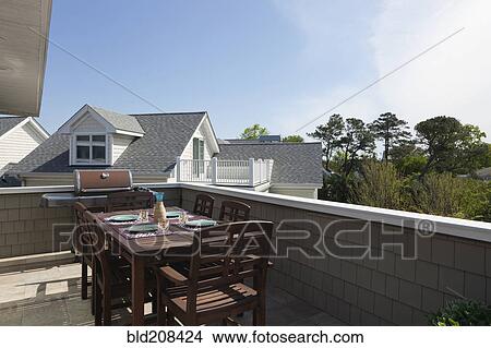 Apartment with terrace, table and chairs View Large Photo Image Picture - Apartment with terrace, table and chairs. Fotosearch