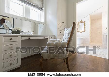 Picture - Armchair at vanity in ornate bedroom. Fotosearch
