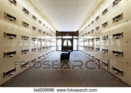 Stock Photograph - Armchair in corridor of modern mausoleum. Fotosearch
