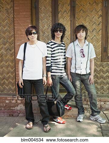 Picture - Asian men standing together. Fotosearch