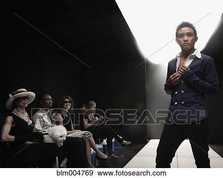Stock Photo - Asian model on runway in fashion show. Fotosearch