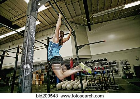 Asian woman exercising in gym View Large Photo Image Stock Image - Asian woman exercising in gym. Fotosearch