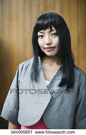 Asian woman in fashionable jacket View Large Photo Image Stock Image - Asian woman in fashionable jacket. Fotosearch