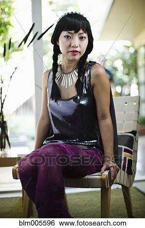 Stock Photograph - Asian woman in glamorous outfit. Fotosearch