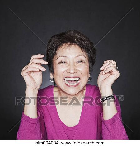 Picture - Asian woman laughing. Fotosearch