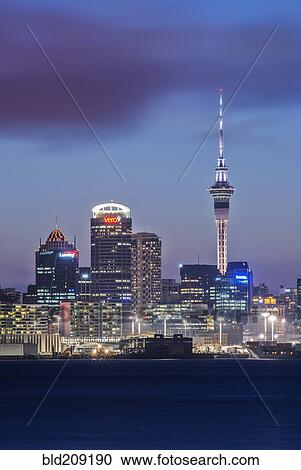 Stock Image - Auckland skyline lit up at night, New Zealand. Fotosearch