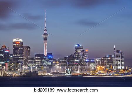 Stock Photo - Auckland skyline lit up at night, New Zealand. Fotosearch