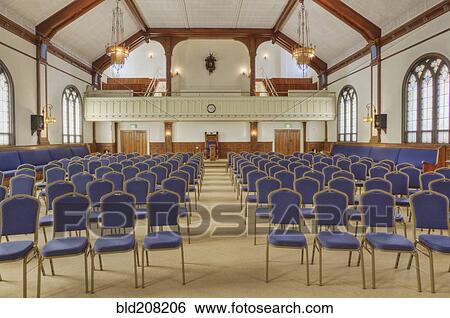 Auditorium with blue chairs, and a stage with curtains View Large Photo Image Stock Photograph - Auditorium with blue chairs, and a stage with curtains. Fotosearch