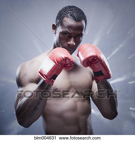 Back lit African boxer with arms raised View Large Photo Image Stock Image - Back lit African boxer with arms raised. Fotosearch