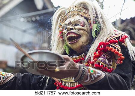Stock Photo - Balinese performer wearing mask and costume, Mas, Bali, Indonesia. Fotosearch