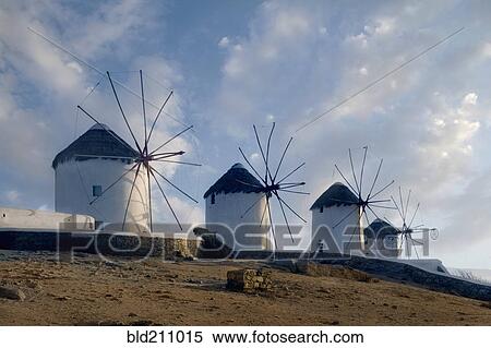 Stock Photography - Bare windmills in rural landscape, Mykonos, Greece. Fotosearch