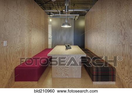 Stock Image - Benches and table in plywood room. Fotosearch