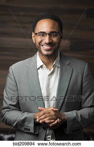 Picture - Black businessman smiling. Fotosearch