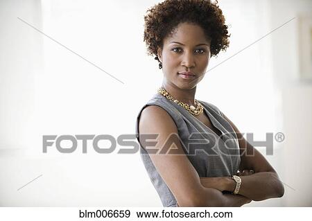 Black businesswoman with arms crossed View Large Photo Image Stock Photo - Black businesswoman with arms crossed. Fotosearch