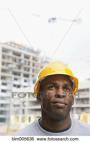 Black construction worker frowning View Large Photo Image Stock Photograph - Black construction worker frowning. Fotosearch