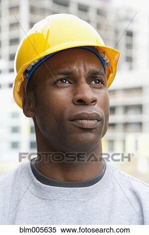 Black construction worker frowning View Large Photo Image Stock Photography - Black construction worker frowning. Fotosearch