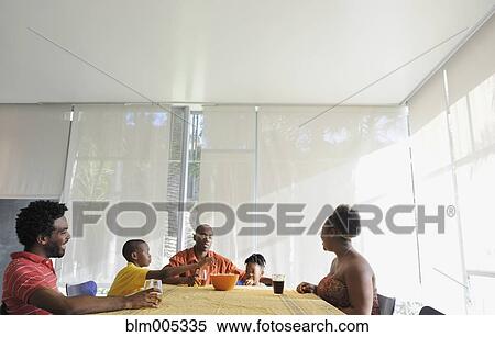 Black family eating at dining room table View Large Photo Image Stock Photography - Black family eating at dining room table. Fotosearch