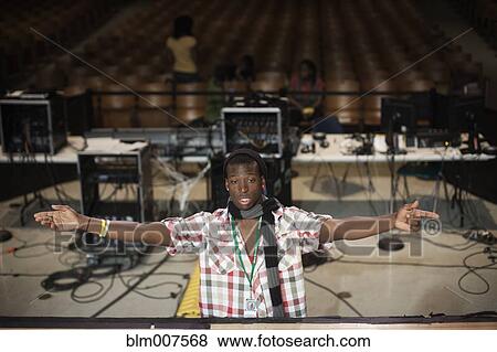 Black man directing stage production View Large Photo Image Stock Photo - Black man directing stage production. Fotosearch