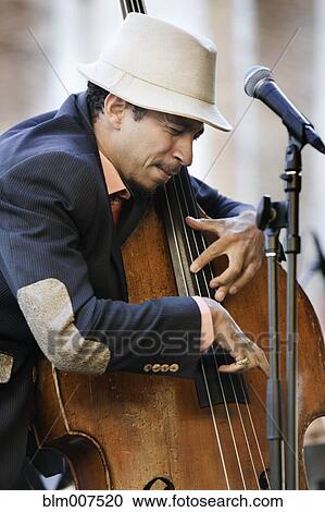 Black man playing bass View Large Photo Image Stock Image - Black man playing bass. Fotosearch