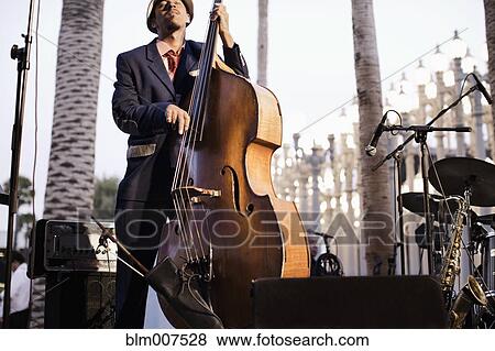 Stock Photo - Black man playing bass. Fotosearch