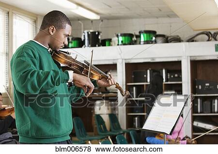 Black student practicing on violin View Large Photo Image Stock Photo - Black student practicing on violin. Fotosearch