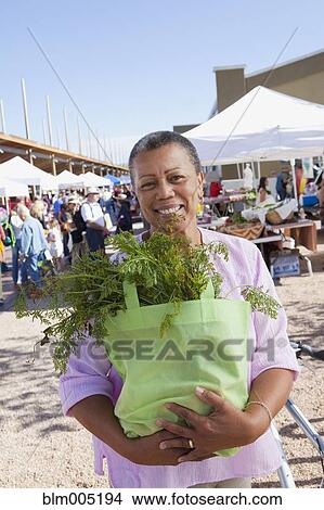 Black woman shopping in farmer's market View Large Photo Image Picture - Black woman shopping in farmer's market. Fotosearch
