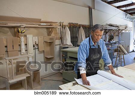 Black woman working in carpentry shop View Large Photo Image Stock Photo - Black woman working in carpentry shop. Fotosearch