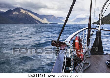 Boat on lake near mountain View Large Photo Image Stock Image - Boat on lake near mountain. Fotosearch
