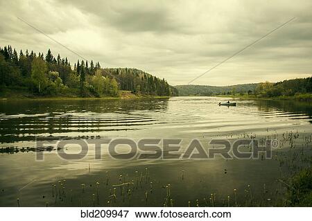 Stock Photo - Boat on rural lake. Fotosearch