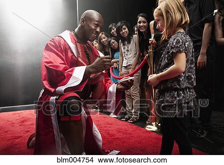 Picture - Boxer signing autograph for fan. Fotosearch